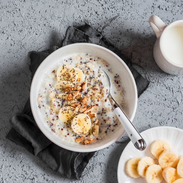 Healthy breakfast coconut milk quinoa porride with bananas
