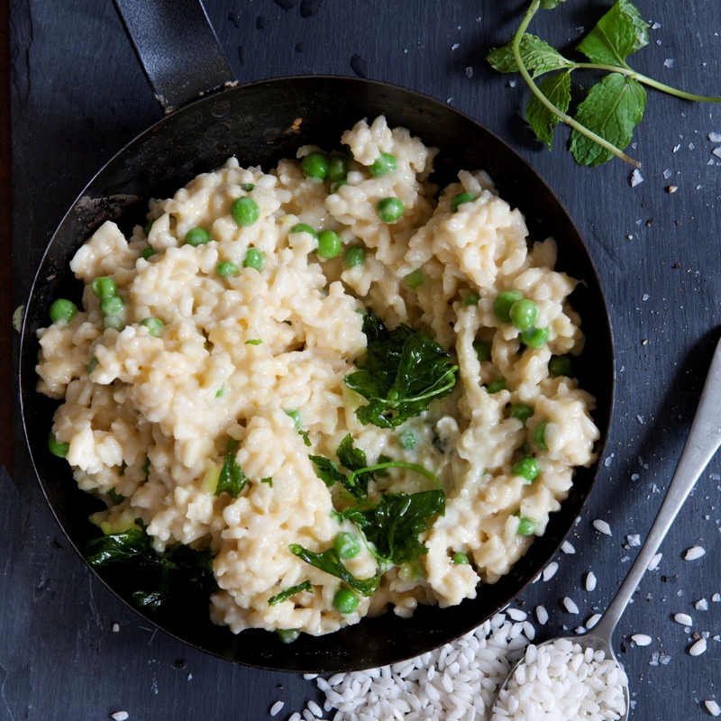 pea and mint risotto on a pan with garnish