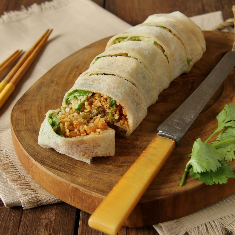 Fresh Spring Rolls on a wooden table Photo