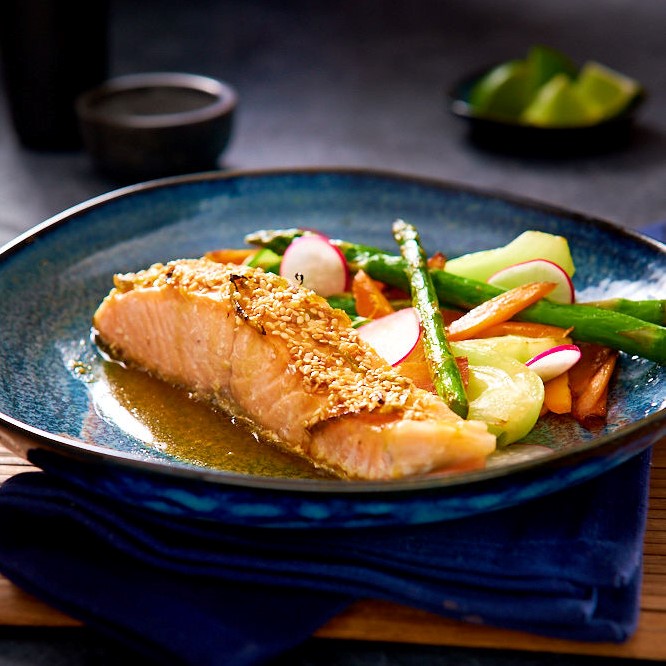 Salmon and Vegetables with Miso Tahini Sauce in a Blue Plate