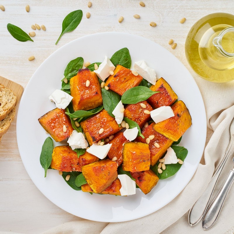 Spinach and Pumpkin Salad Bowl on White Table