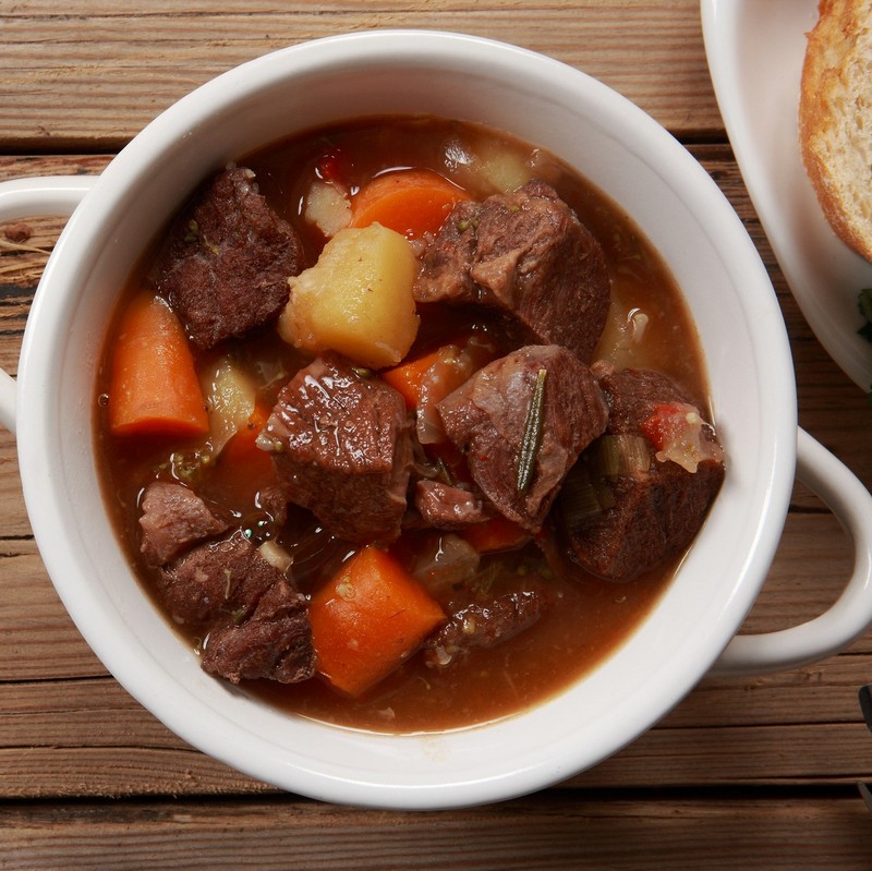 Beef Stew and Vegetables bowl on Wooden Table