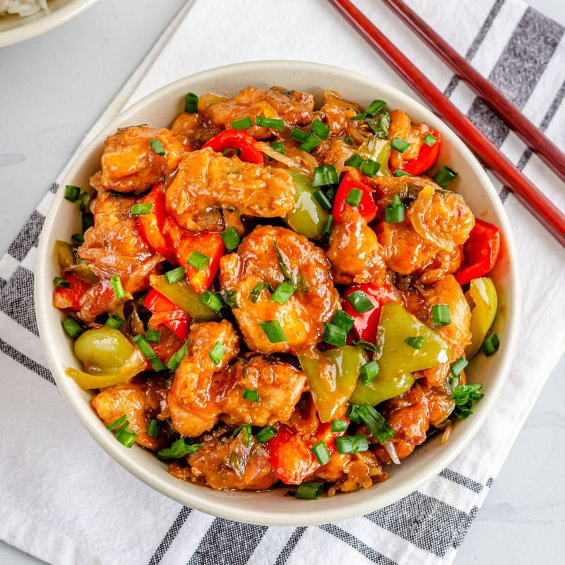 Bowl of Sweet and Sour Chicken on White Table
