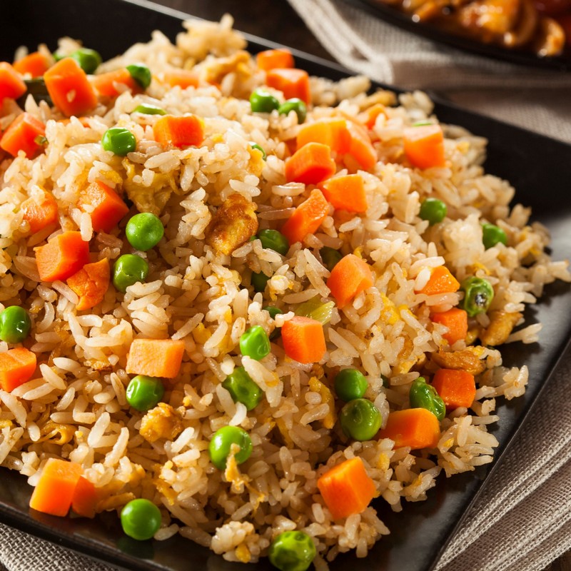 Vegetable Fried Rice in a Black Plate Close Up Photo